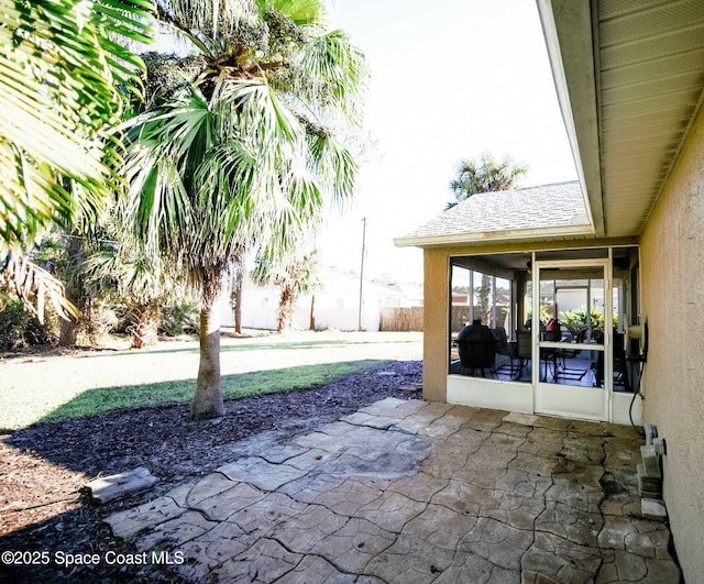 view of patio / terrace with a sunroom