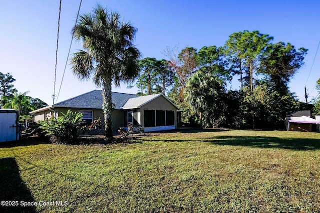 view of yard with a sunroom