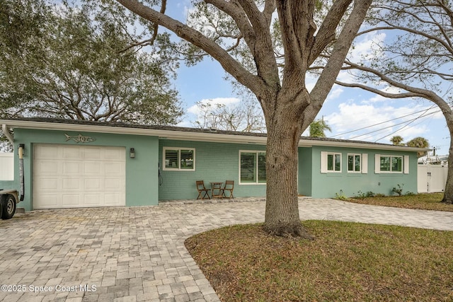 single story home with a garage