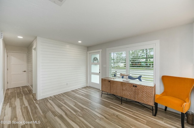 sitting room featuring wood-type flooring