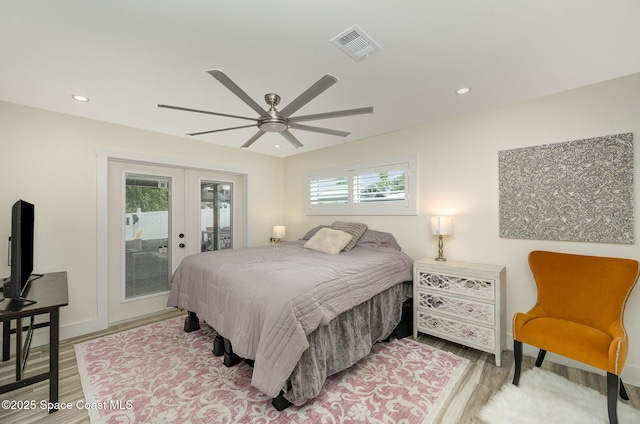 bedroom with ceiling fan, french doors, access to outside, and hardwood / wood-style floors