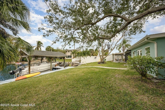 view of yard with a dock