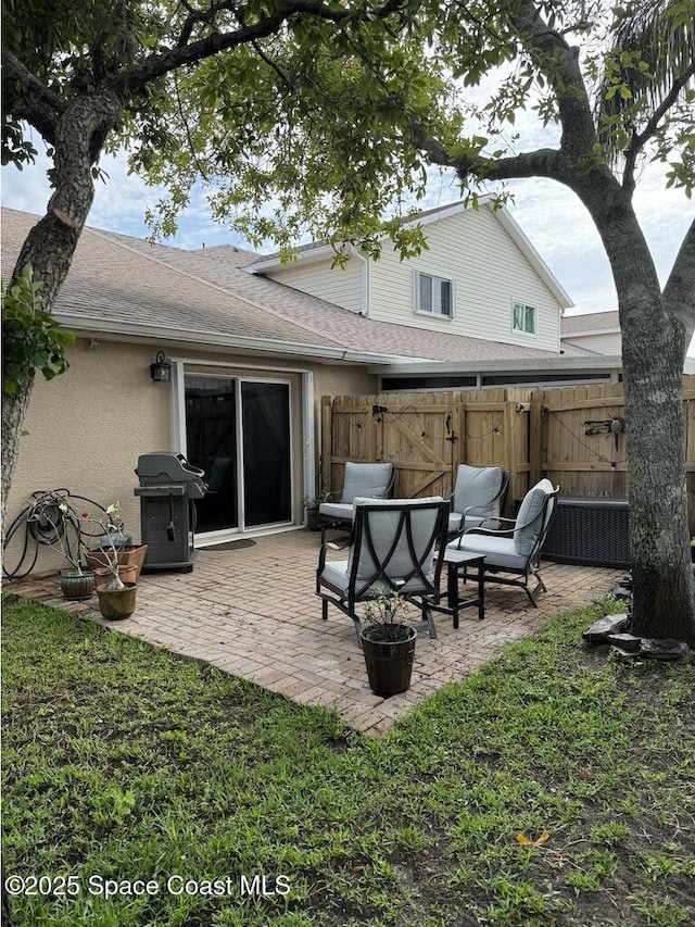 rear view of property with a patio