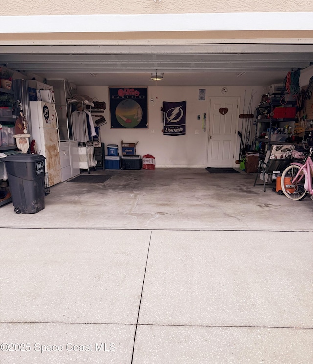 garage featuring white refrigerator