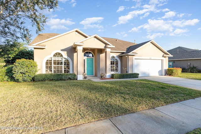 ranch-style home with a garage and a front yard