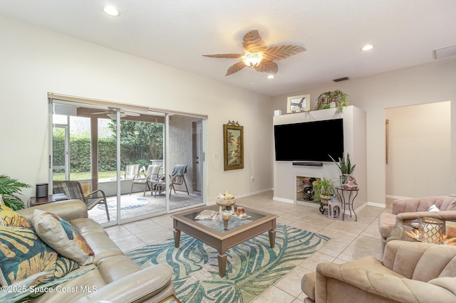 living room with ceiling fan and light tile patterned flooring