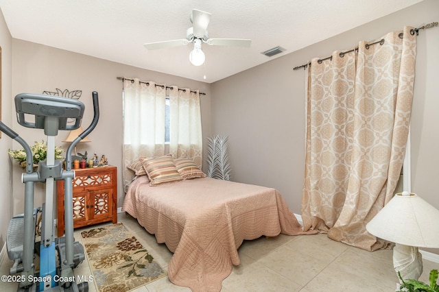 tiled bedroom with ceiling fan