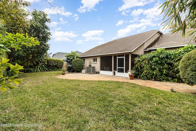 view of yard featuring a patio and a sunroom