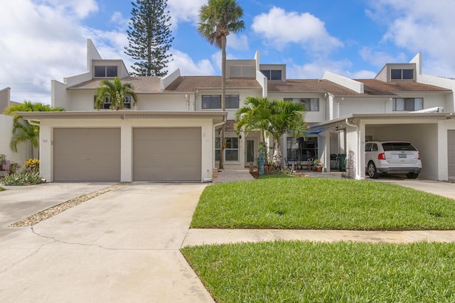 view of front of house with a front yard and a garage