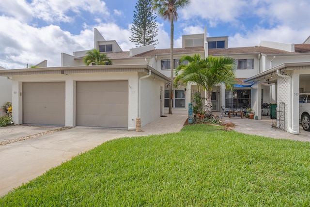 view of front of property with a garage and a front yard