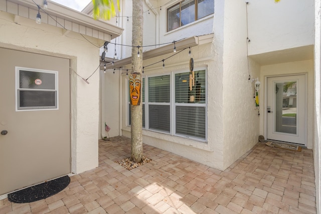 doorway to property with a patio