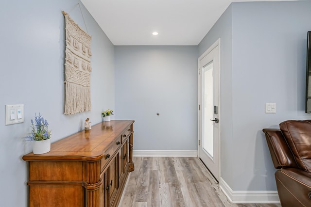 doorway to outside featuring light hardwood / wood-style floors