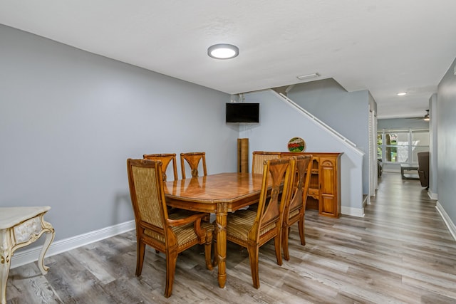 dining area with hardwood / wood-style floors