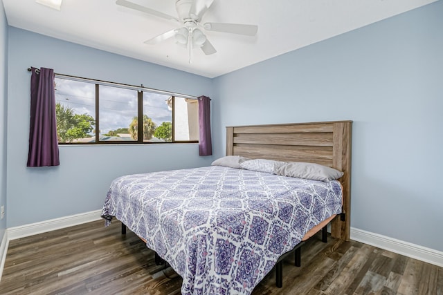 bedroom featuring ceiling fan and dark hardwood / wood-style floors