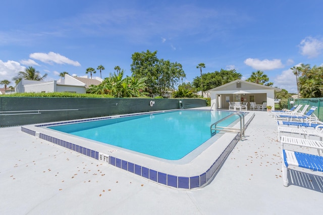 view of swimming pool with a patio area