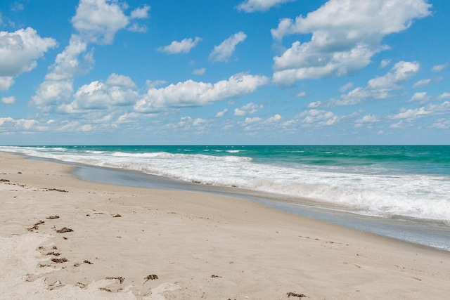 property view of water featuring a beach view