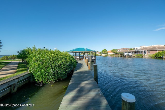 dock area featuring a gazebo and a water view