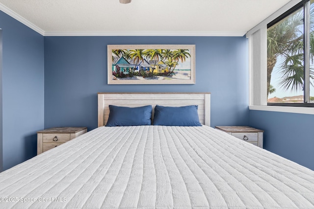 bedroom featuring multiple windows and ornamental molding