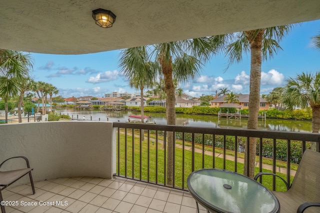 balcony featuring a water view