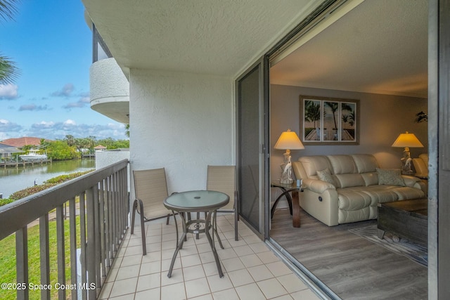 balcony featuring a water view