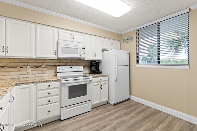 kitchen with white cabinets, backsplash, white appliances, and a textured ceiling