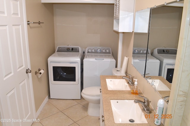 washroom featuring washer and clothes dryer and sink