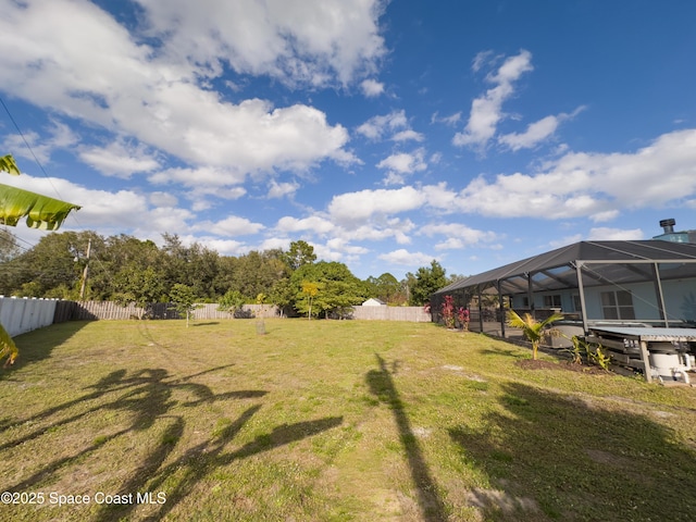 view of yard with a lanai