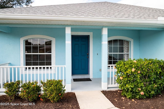 entrance to property with a porch