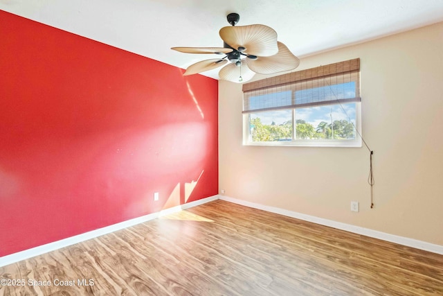 unfurnished room featuring hardwood / wood-style flooring and ceiling fan