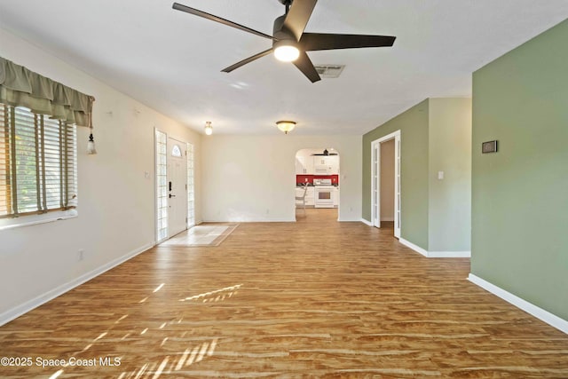 interior space with ceiling fan and hardwood / wood-style floors