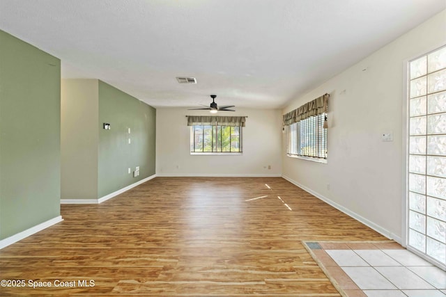 unfurnished room featuring ceiling fan and light hardwood / wood-style flooring