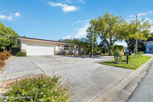 ranch-style house featuring a garage