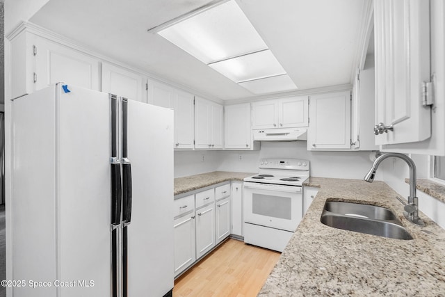 kitchen featuring sink, white appliances, white cabinetry, light hardwood / wood-style flooring, and light stone countertops