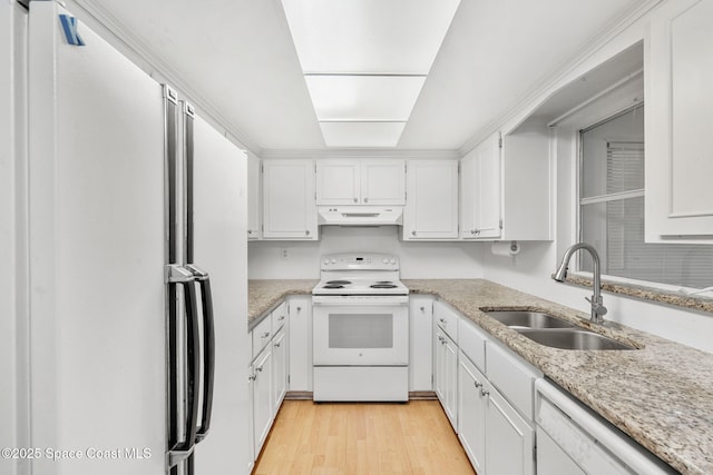 kitchen featuring white appliances, white cabinets, light hardwood / wood-style floors, sink, and light stone counters