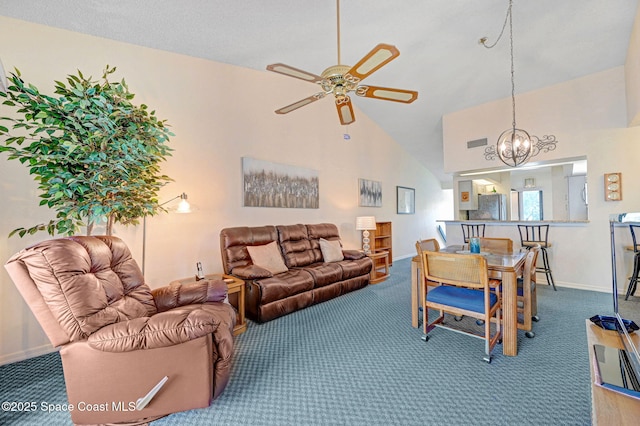 carpeted living room featuring lofted ceiling and ceiling fan with notable chandelier