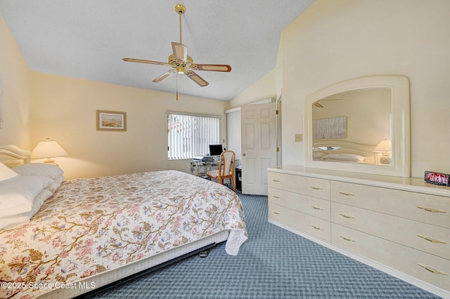 carpeted bedroom with ceiling fan and vaulted ceiling