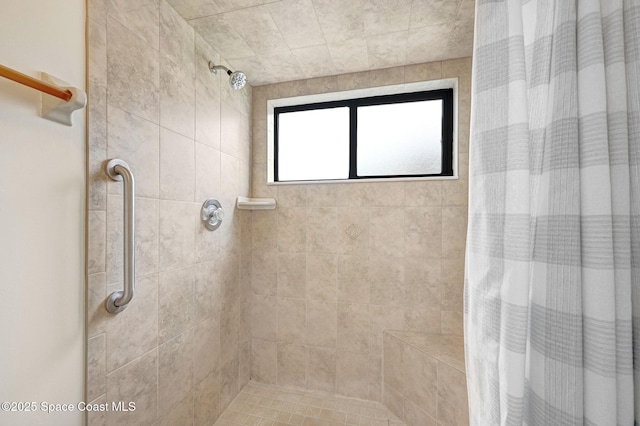 bathroom featuring a shower with curtain