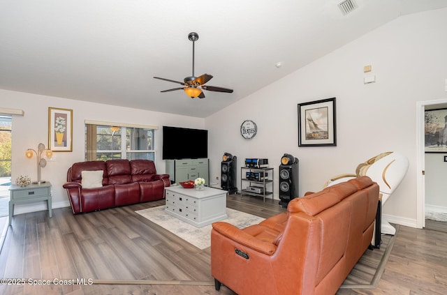 living room with ceiling fan, hardwood / wood-style floors, and lofted ceiling