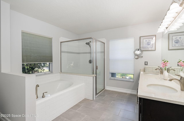 bathroom with independent shower and bath, tile patterned flooring, and vanity