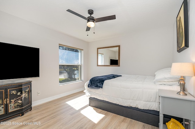 bedroom featuring ceiling fan and light hardwood / wood-style floors