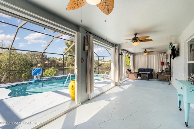 sunroom / solarium featuring a pool, a water view, and ceiling fan