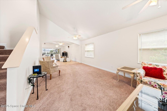 interior space with high vaulted ceiling, carpet flooring, and ceiling fan