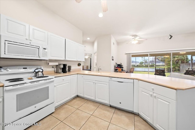 kitchen featuring sink, white appliances, ceiling fan, white cabinets, and kitchen peninsula