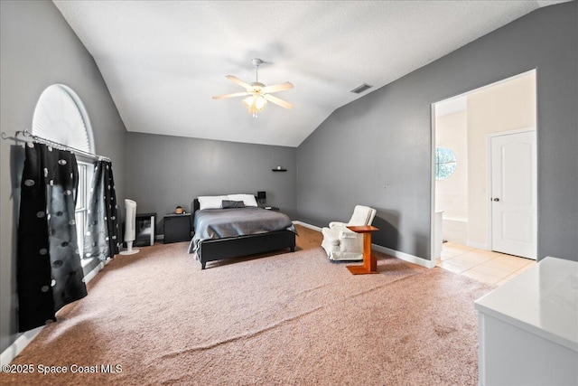 carpeted bedroom with lofted ceiling, ensuite bath, and ceiling fan