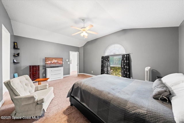 carpeted bedroom with ceiling fan and lofted ceiling