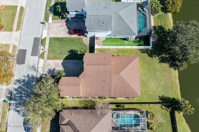 birds eye view of property with a water view