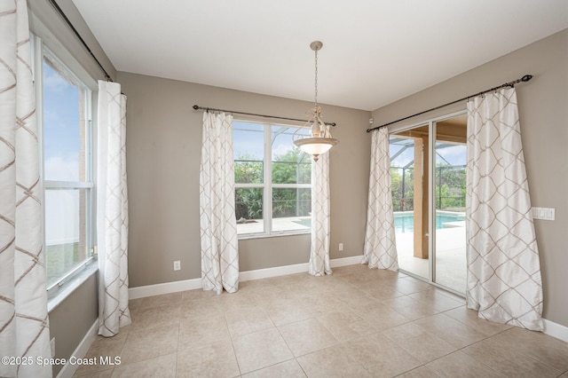 unfurnished dining area with light tile patterned floors