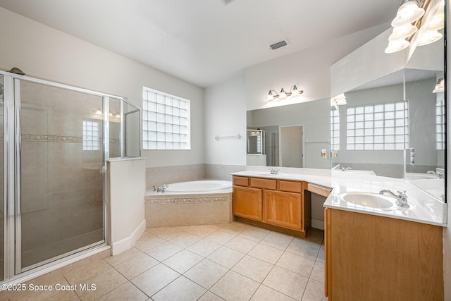 bathroom with tile patterned floors, vanity, and independent shower and bath