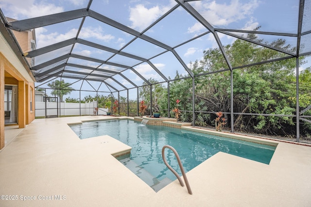 view of swimming pool with a lanai and a patio