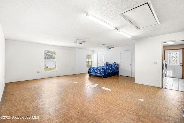 interior space with ceiling fan